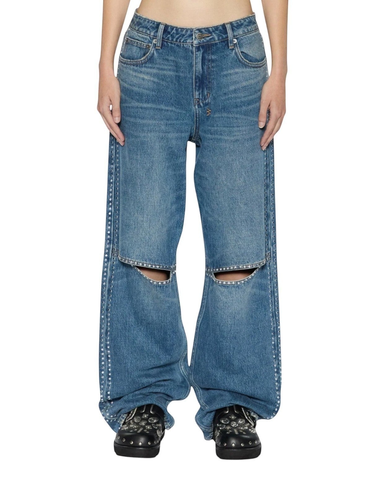 Naked Pear Ksubi Low Rider jeans in indigo denim with silver studs and knee cutouts on a model