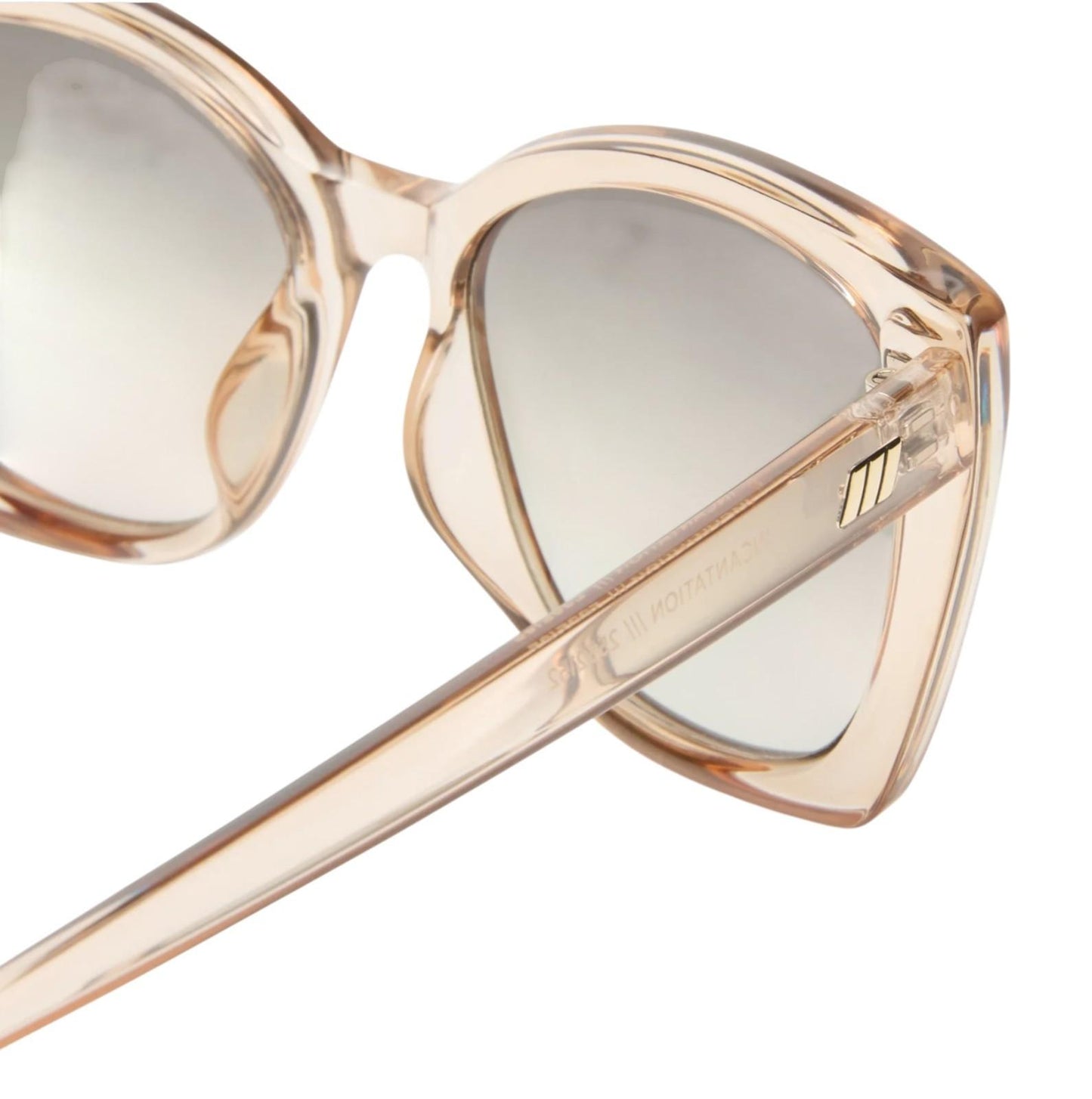 Heart-shaped sunglasses with beige frame and light-colored lenses on a white background