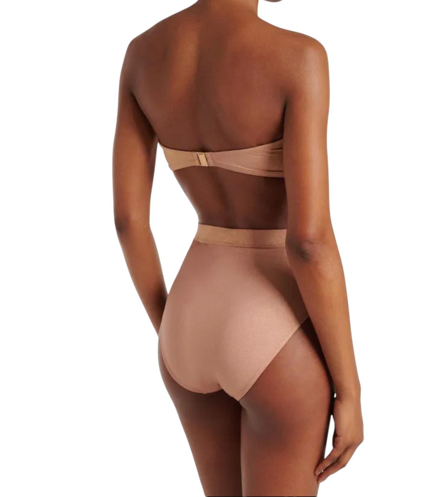 Beige swimsuit with open back design on a white background