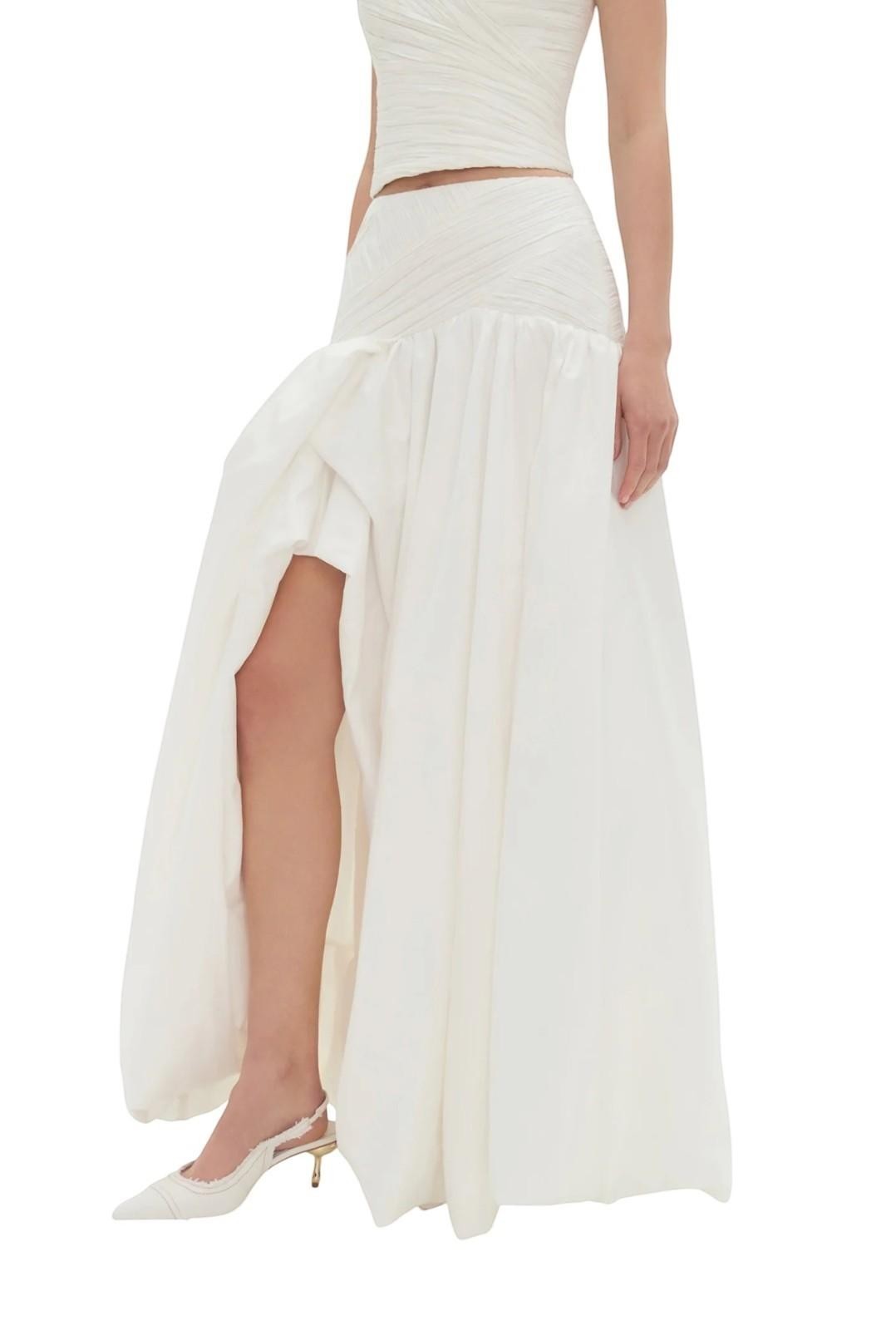 Naked Pear Aje Constellation ivory midi skirt with ruched waist, asymmetric draped bubble hem, and front leg slit.