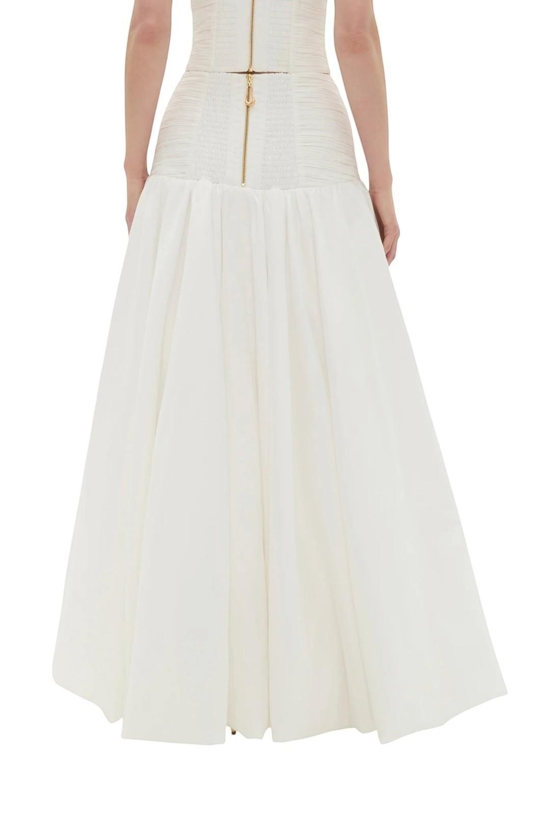 Naked Pear Aje Constellation ivory cotton midi skirt with a ruched waist and back zip detail, back view.