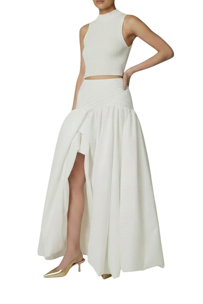 AI generated image of  Naked Pear Aje Constellation ivory cotton midi skirt with ruched waist, asymmetric draped bubble hem, and front slit