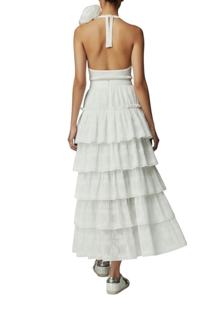 AI generated image of Naked Pear Aje Merritt ivory embroidered midi skirt with tiered ruffles, scallop trim, and a high-waisted silhouette.