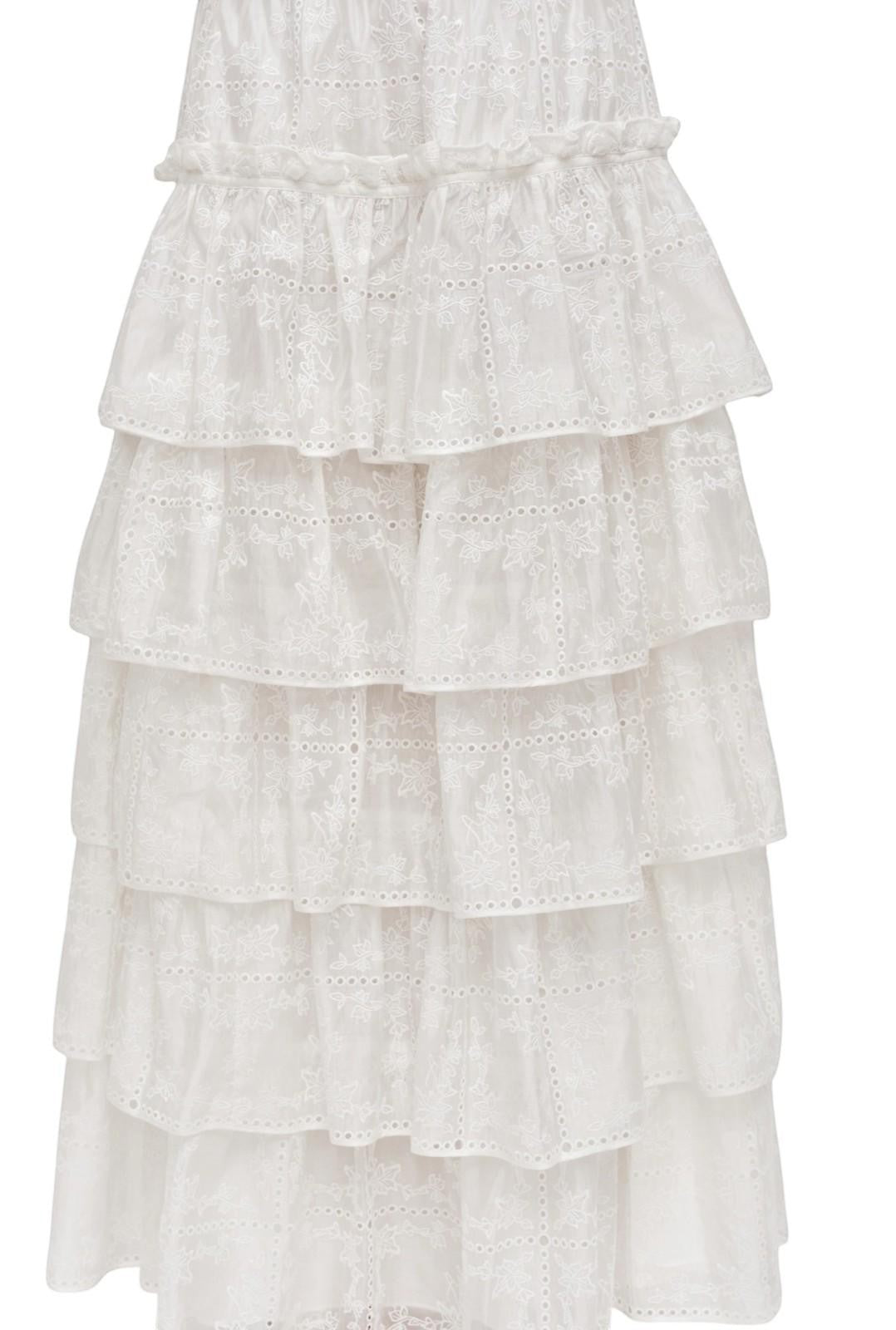 Naked Pear Aje Merritt ivory midi skirt featuring tiered ruffles, intricate Anglaise embroidery, and scallop trim.