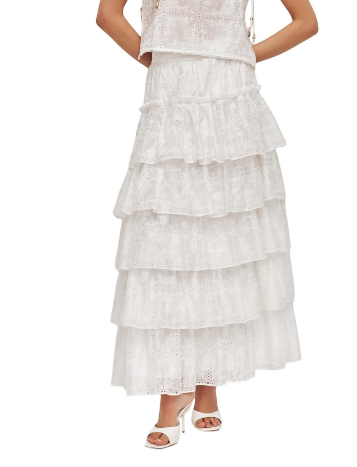 Naked Pear Aje Merritt ivory midi skirt featuring tiered ruffled layers with intricate Anglaise embroidery and trim.