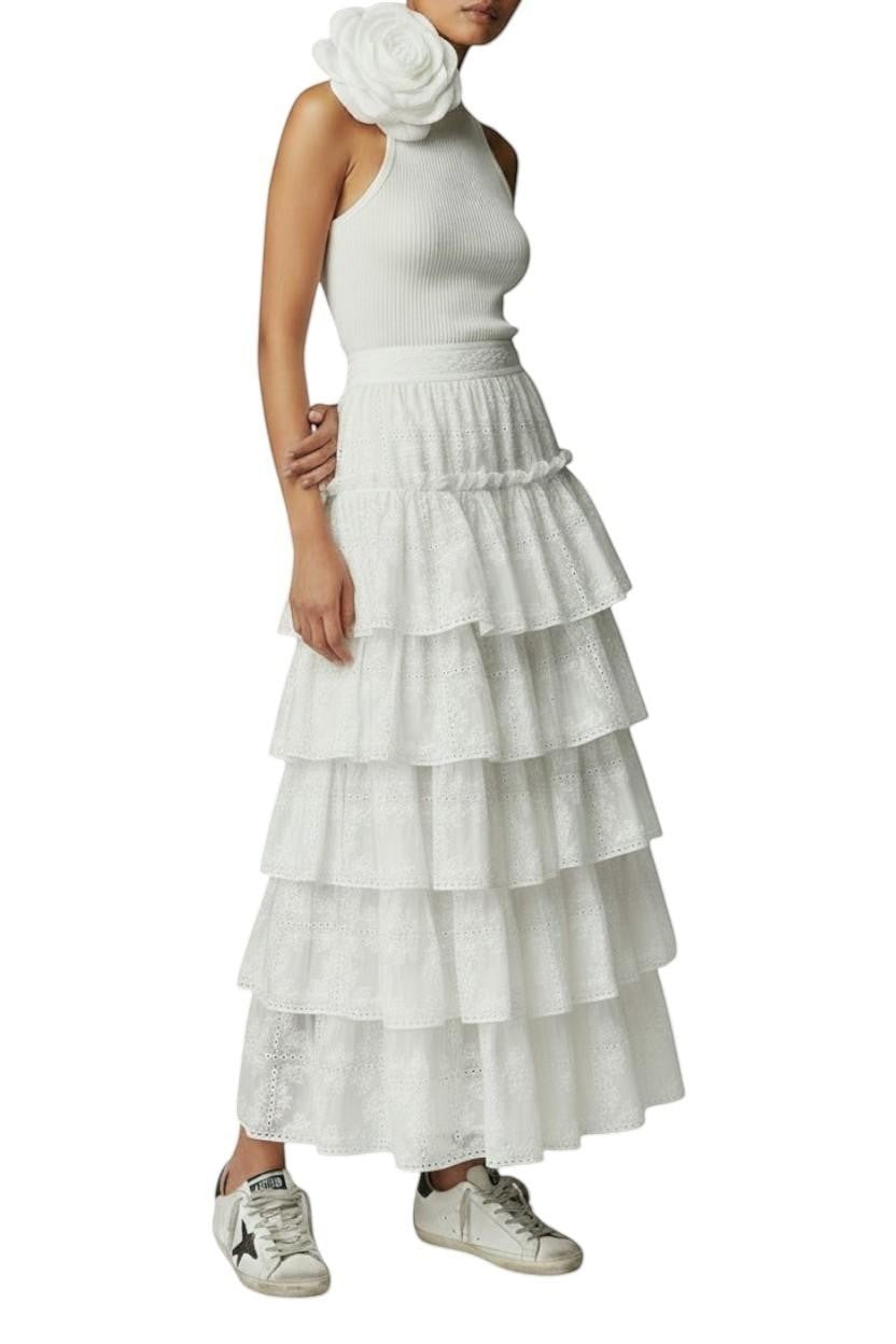 AI generated image of Naked Pear Aje Merritt ivory midi skirt featuring tiered Anglaise embroidery, scallop trim, and a voluminous silhouette