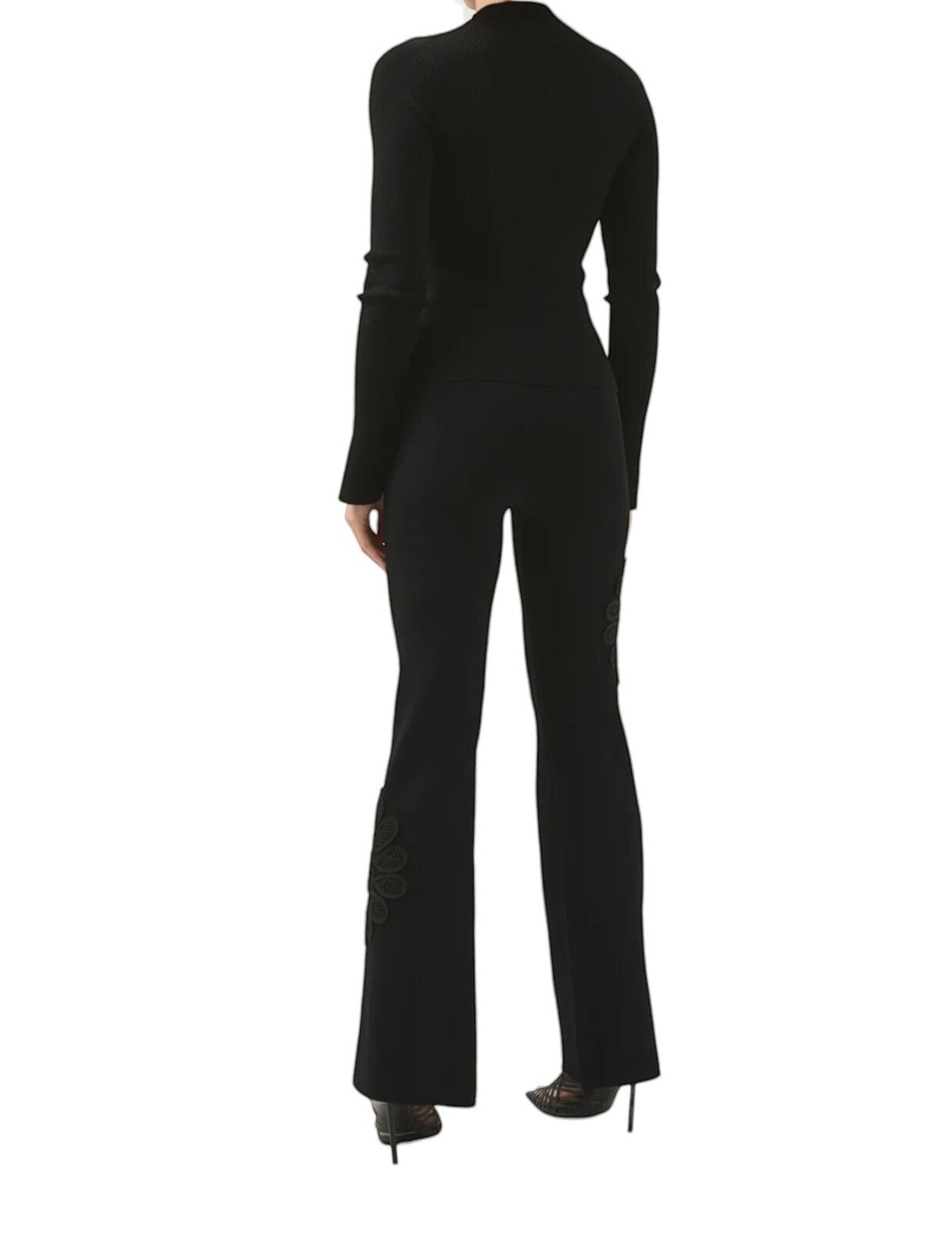Naked Pear Aje Motion Mandala black high-waisted knit pants with flared legs and floral lace detail from behind