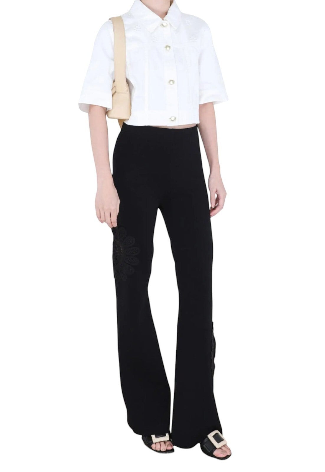 Naked Pear Aje Motion Mandala black high-waisted knit pants with flared legs and intricate lace flower side detail.