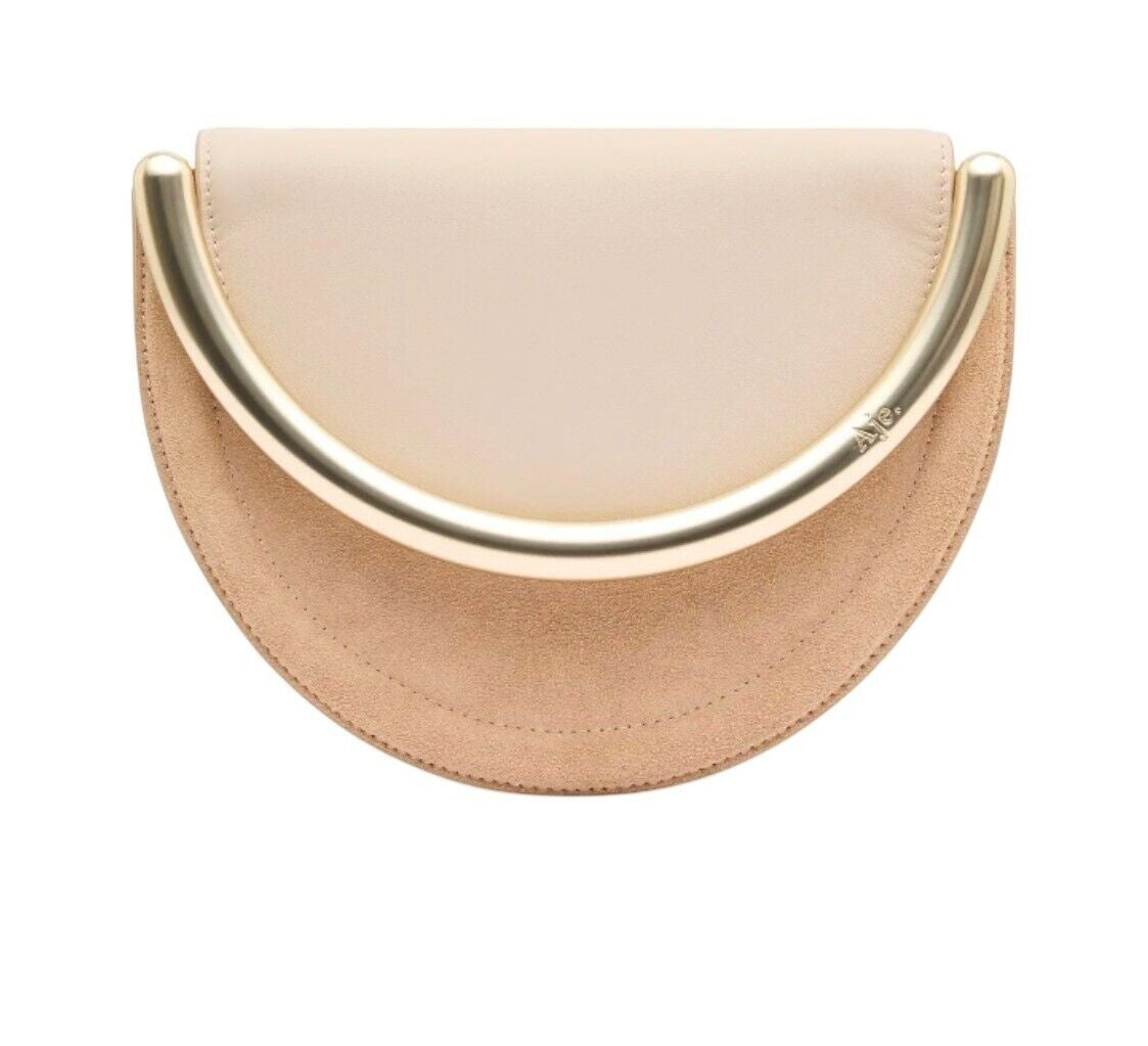 Naked Pear Aje Norma crescent crossbody bag in beige suede and leather with a gold metal crescent handle.