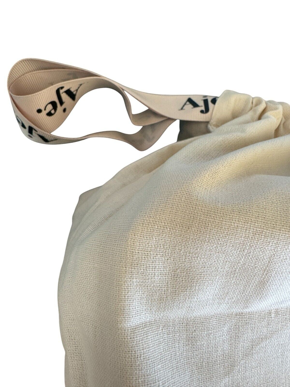 Naked Pear Aje branded cream cotton dust bag with logo ribbon drawstring