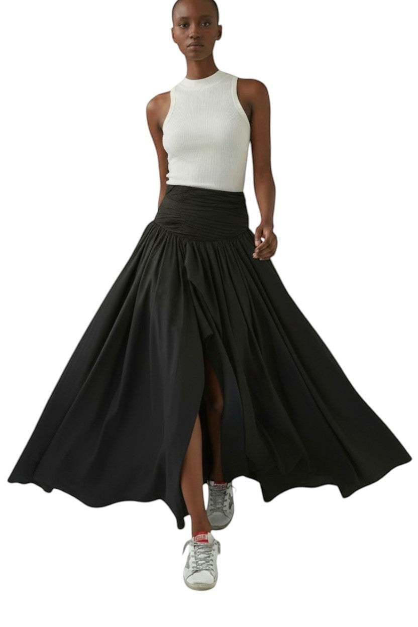 AI generated image of Model wearing Naked Pear Aje Violette black cotton maxi skirt with ruched waist, front slit, and bubble hem
