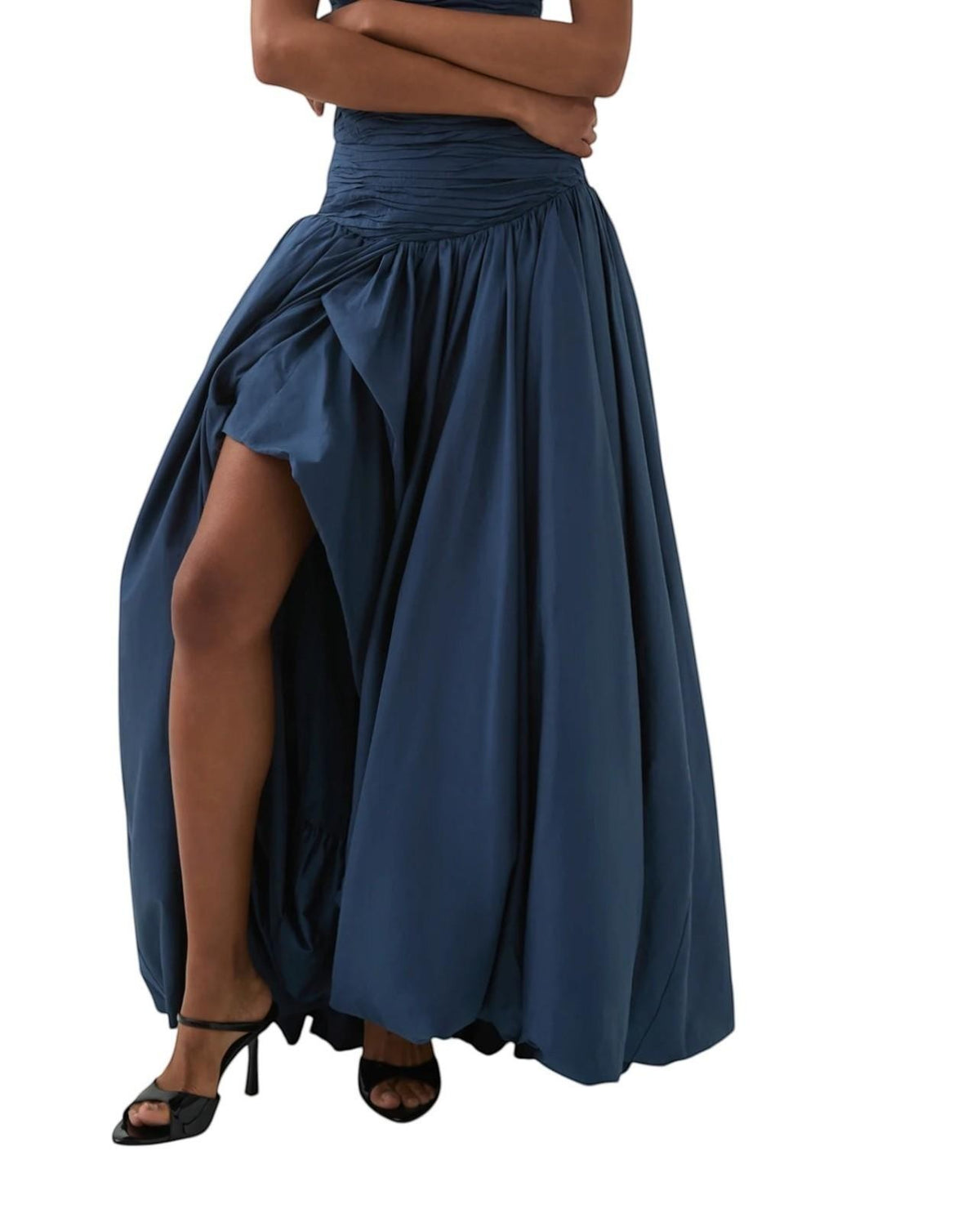 Naked Pear Aje Violette slate blue cotton maxi skirt with a ruched waist, asymmetric drape, and bubble hem detail.