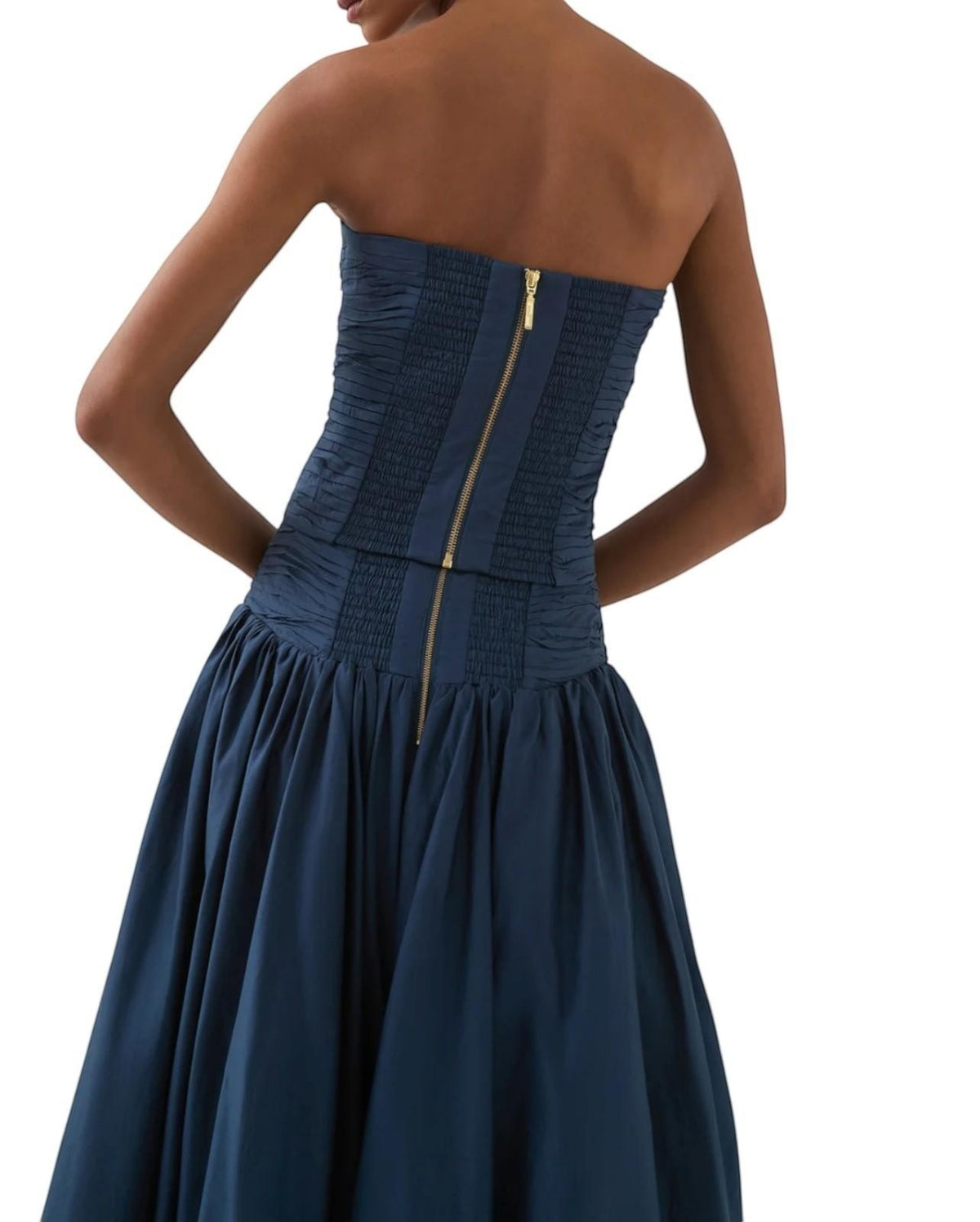 Naked Pear Aje slate blue cotton maxi skirt with ruched waist and back zip detail on a model