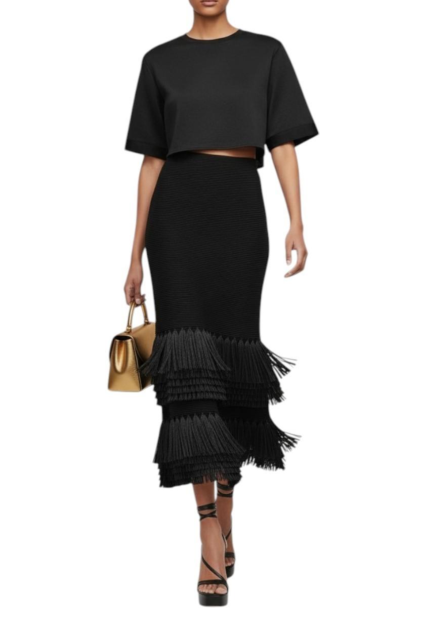 AI generated image of Woman wearing a black outfit with a fringed skirt and holding a gold handbag on a white background
