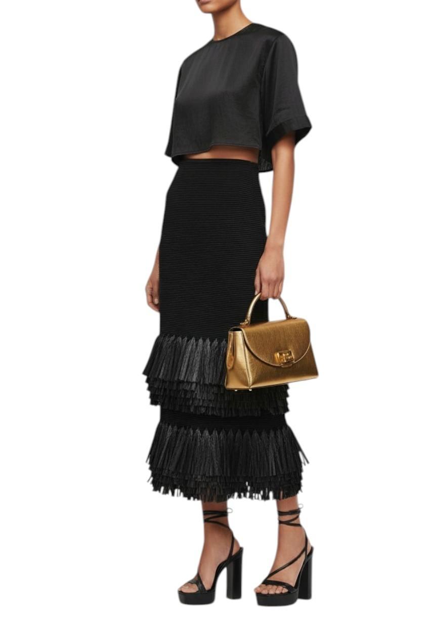 AI generated image of Person wearing a black outfit with a ruffled skirt and holding a gold handbag on a white background