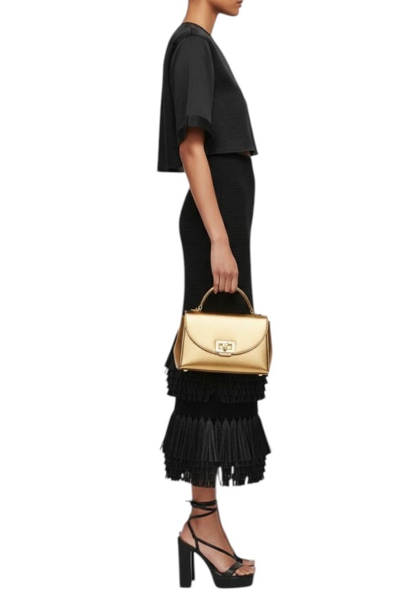 AI generated image of Woman holding a gold handbag against a white background