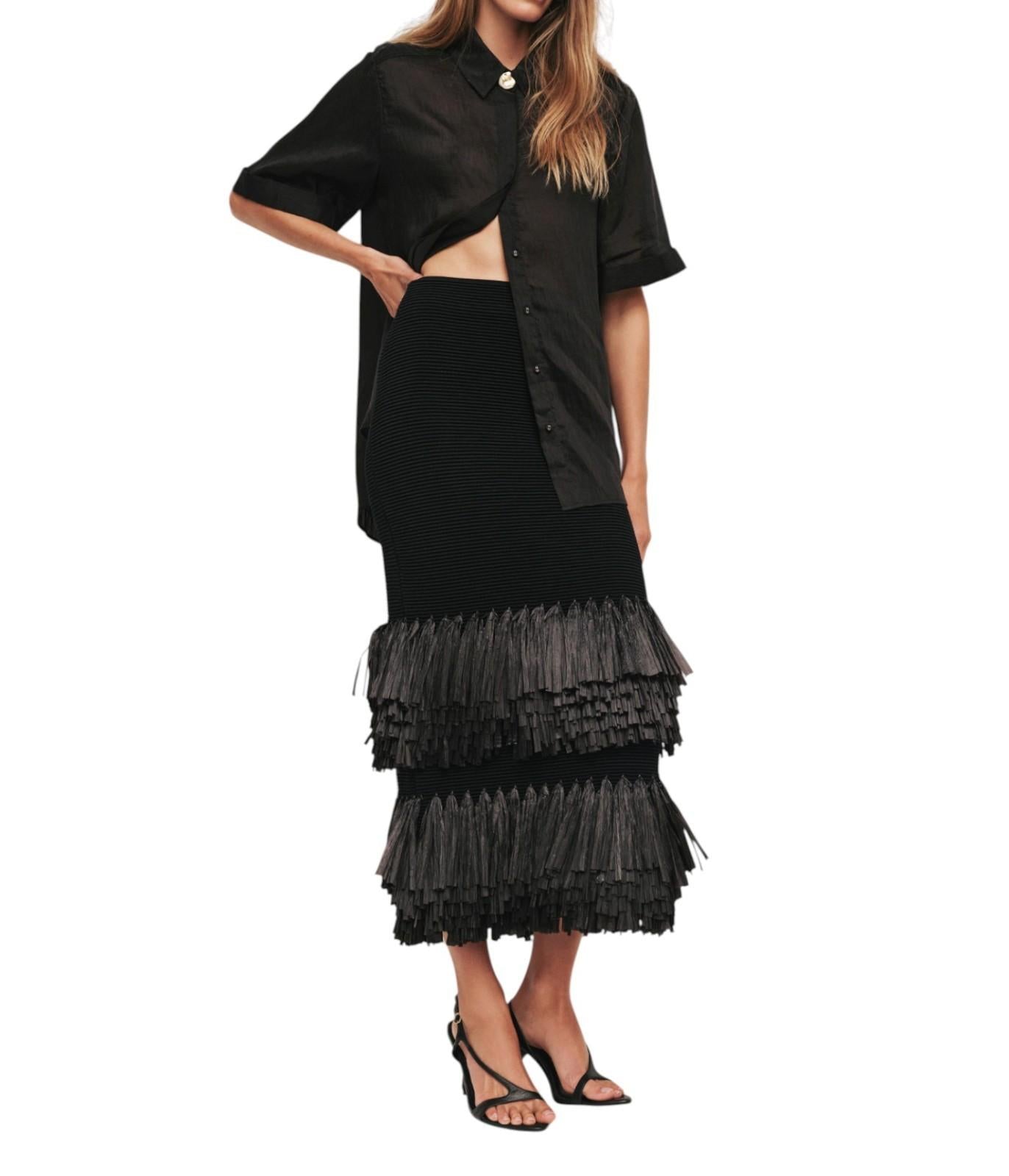 Black layered dress with a white background