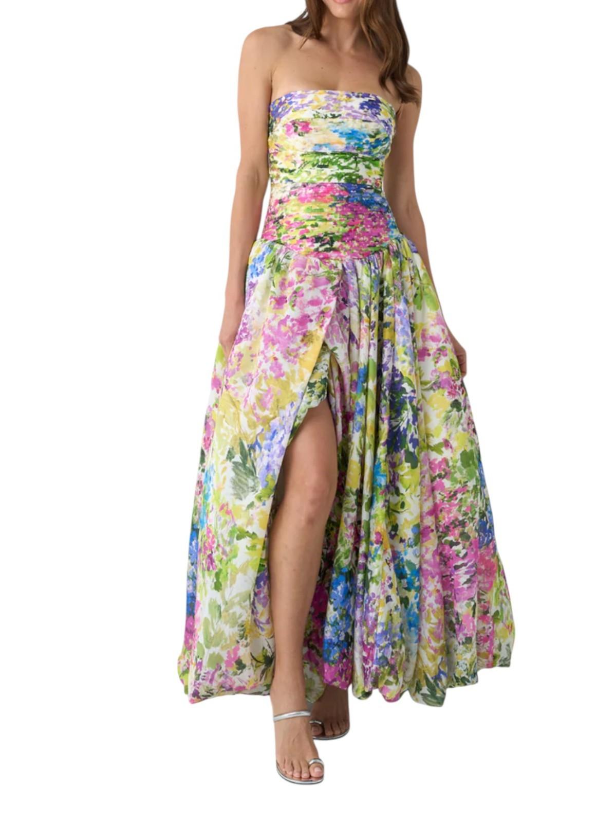 Floral strapless dress with a high slit on a white background