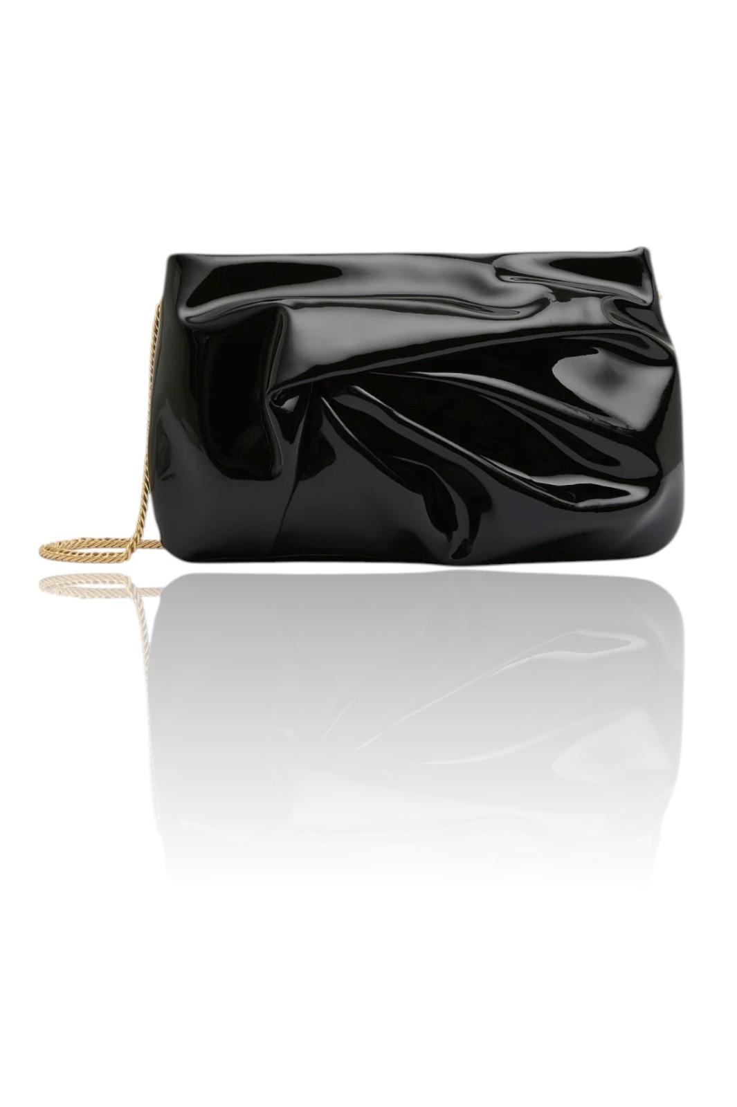Black textured clutch bag with a gold chain on a white background
