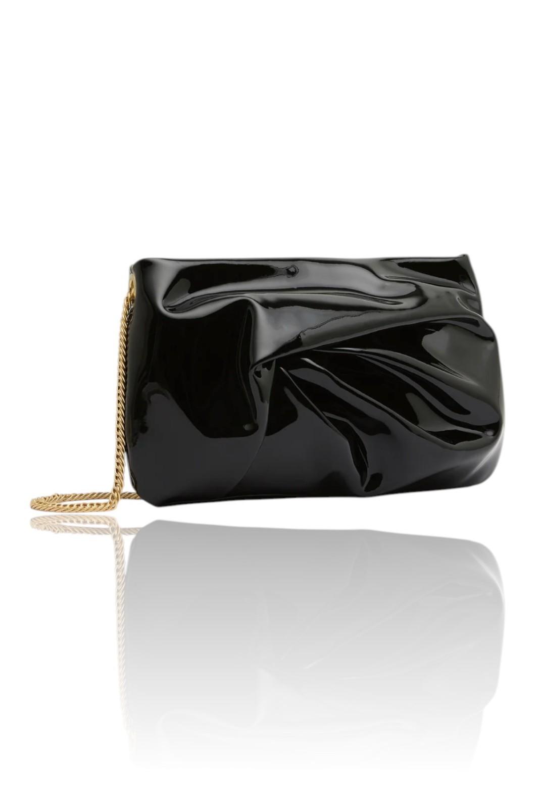 Black clutch bag with a gold chain on a white background
