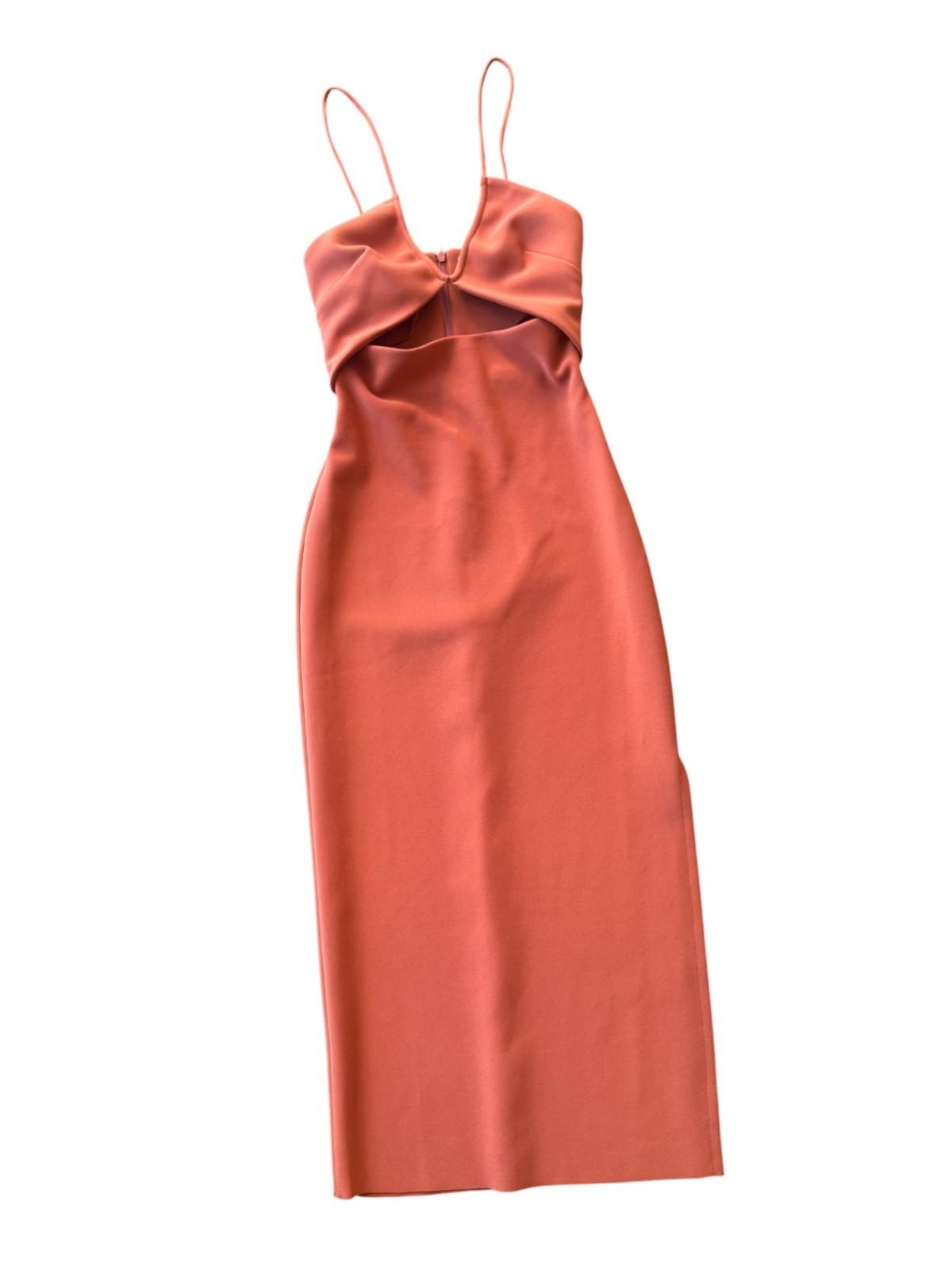 Coral-colored dress with thin straps on a white background