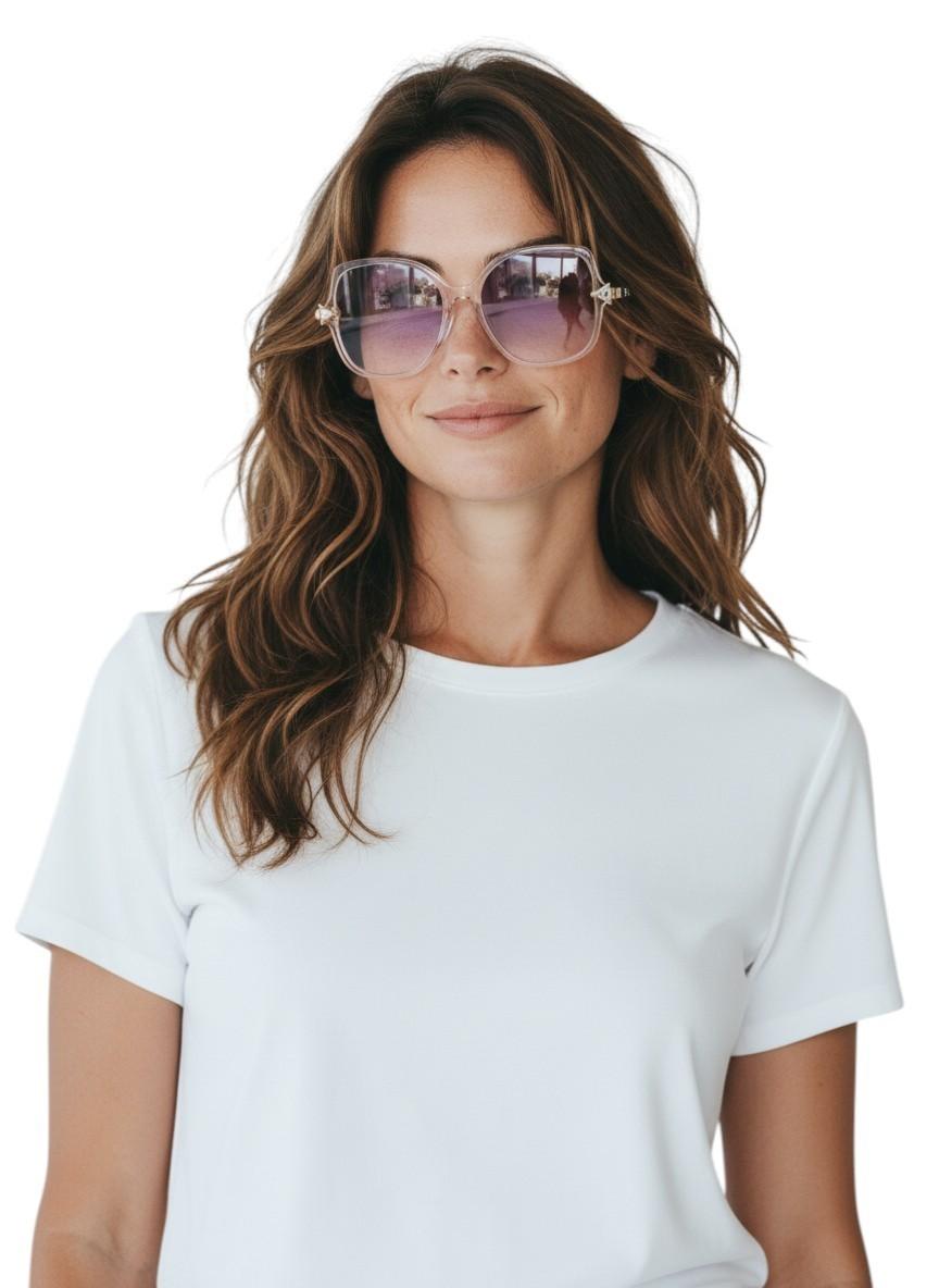 Woman wearing a white t-shirt and sunglasses on a plain background