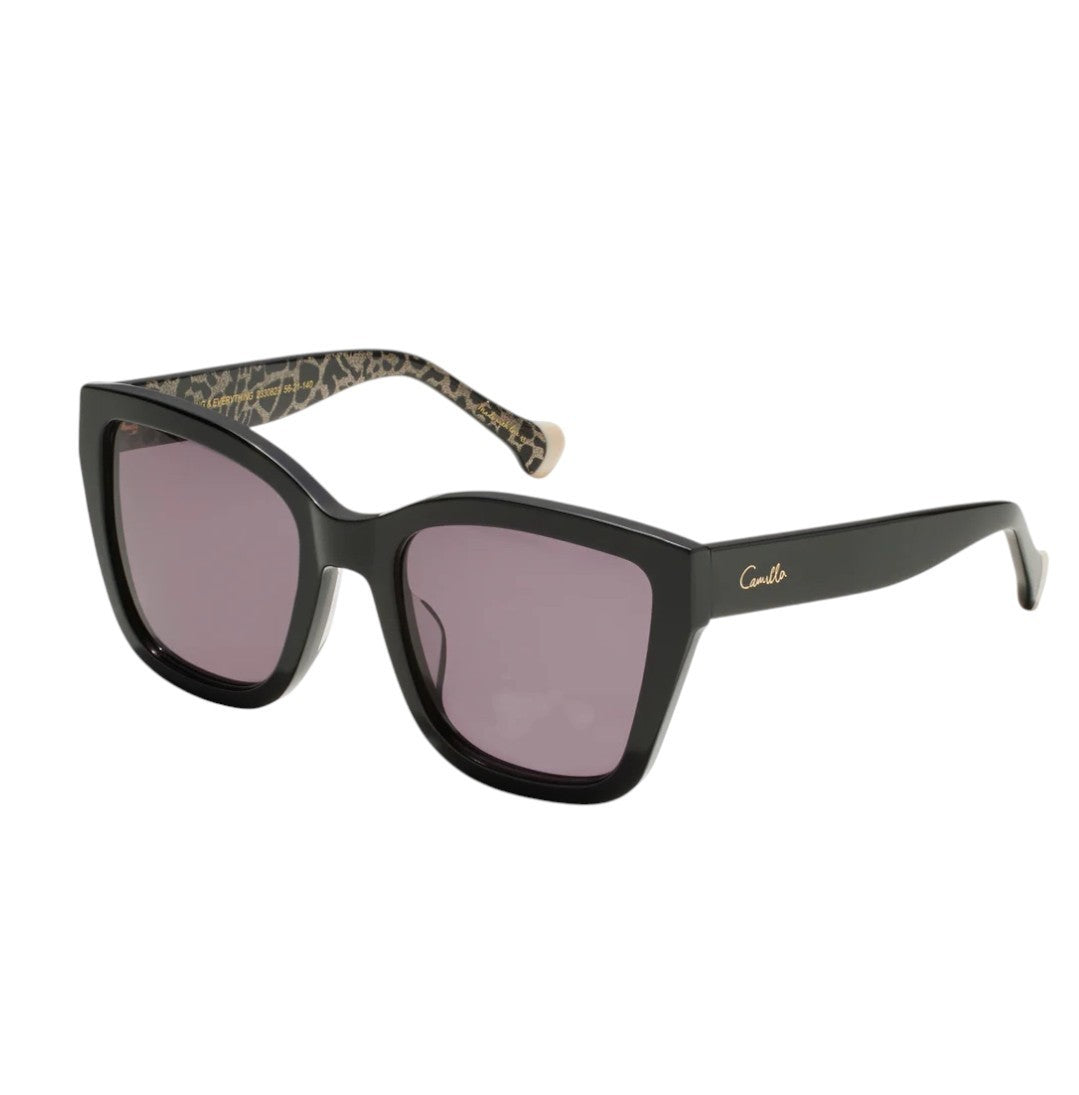 Black sunglasses with a leopard print arm on a white background