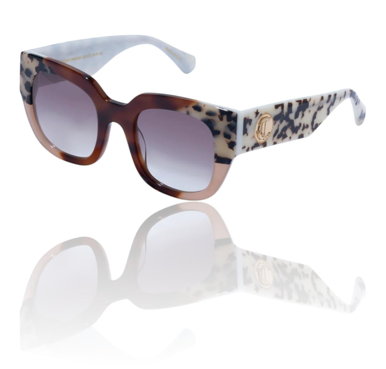 Sunglasses with tortoiseshell frame and floral pattern on arm against a white background