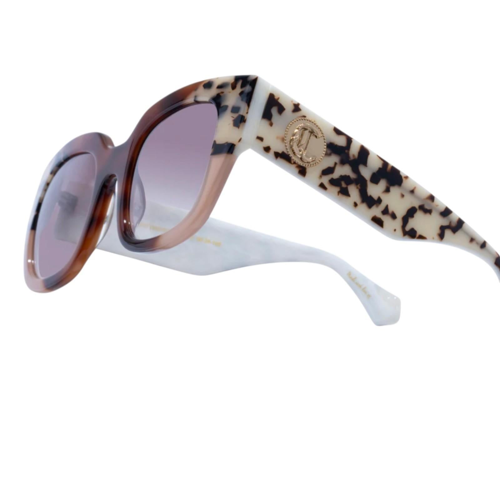 Sunglasses with leopard print arms and white frame on a white background