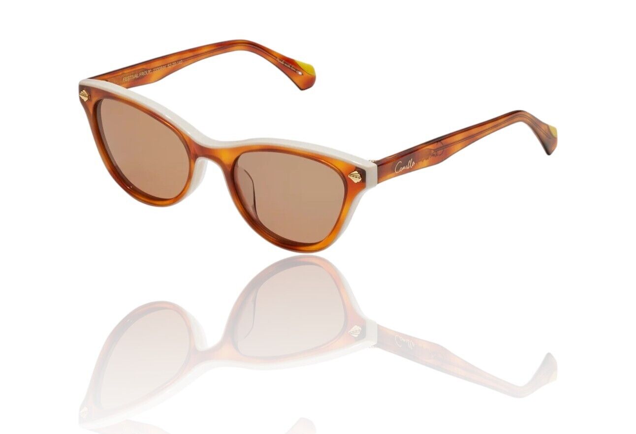 A pair of tortoise shell acetate cat-eye sunglasses with ivory halo and gold foil detailing on the temples.