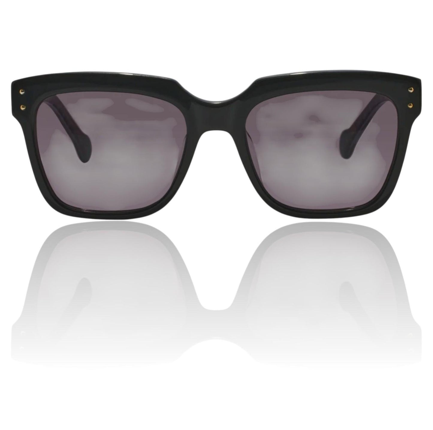 Black sunglasses with dark lenses on a reflective white surface