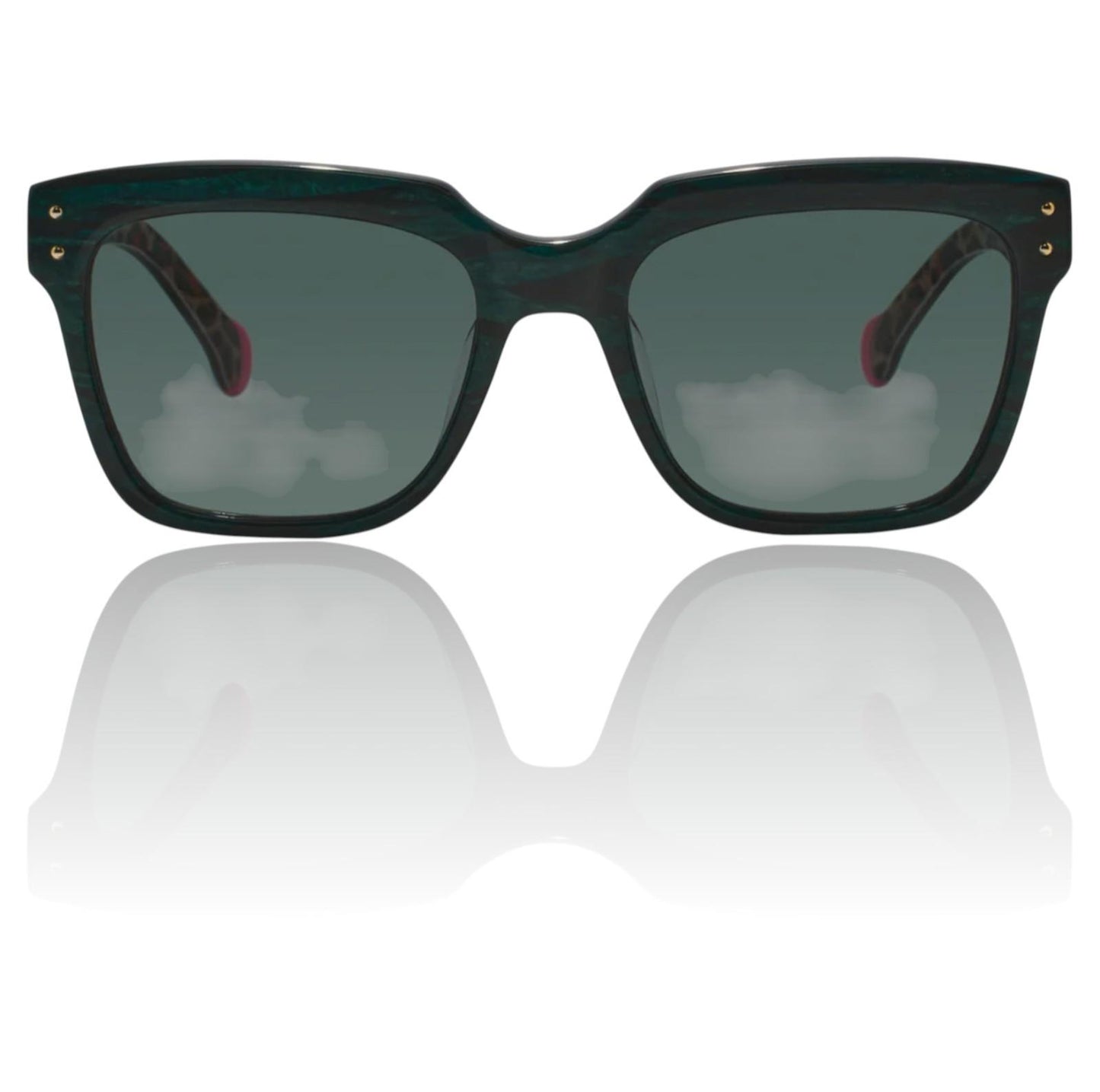 Sunglasses with dark lenses and green frames on a reflective white surface