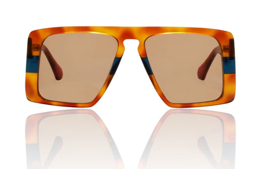 A pair of square-shaped, vintage-inspired sunglasses with a tortoise shell pattern in navy and brown colors, featuring oversized full-frame acetate lenses.
