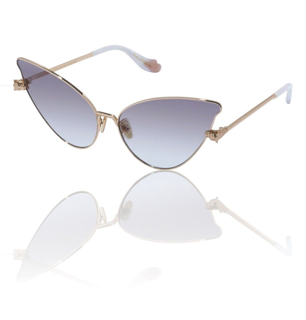 A pair of gold metal Sunglasses with a cat eye butterfly shape and brown lenses reflecting light.