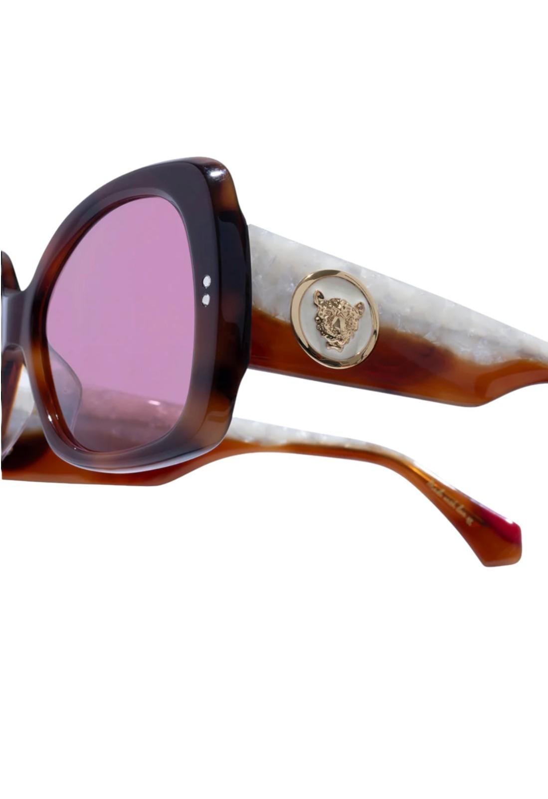 Sunglasses with a brand logo on a white background