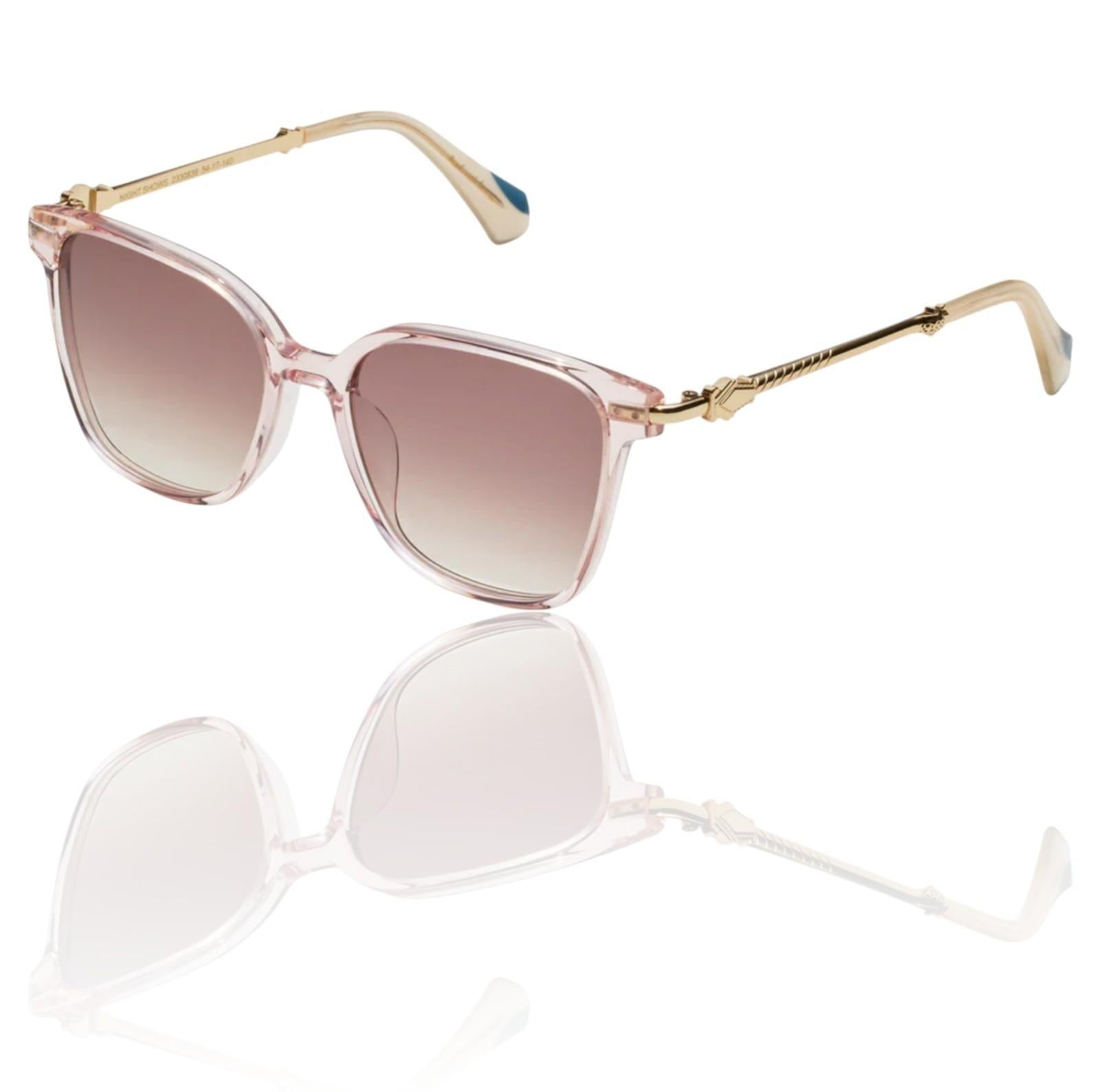 Sunglasses with pink gradient lenses and gold frames on a white background