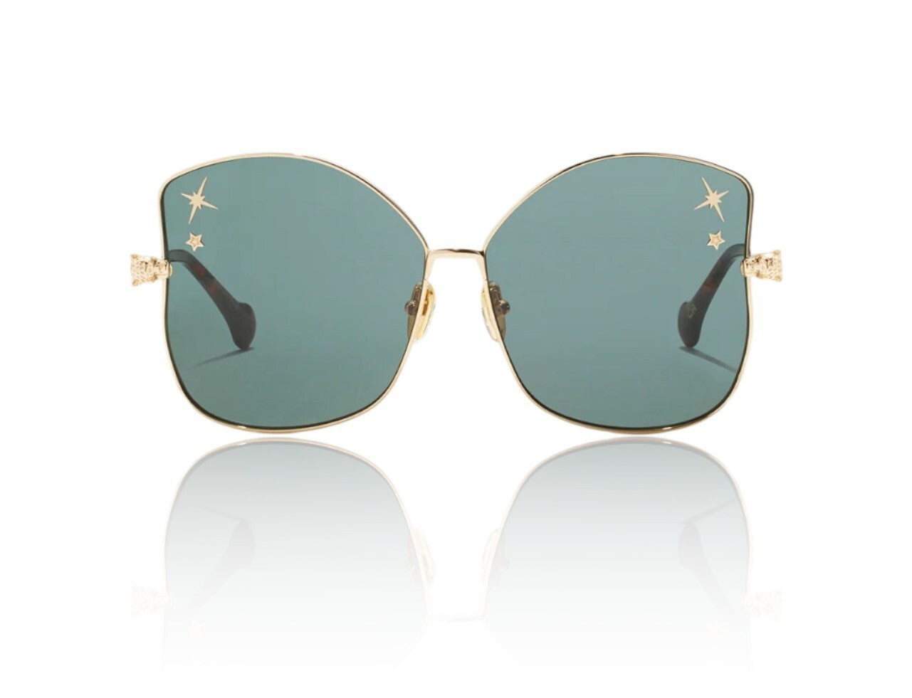 Sunglasses with gold frame and green lenses on a white background
