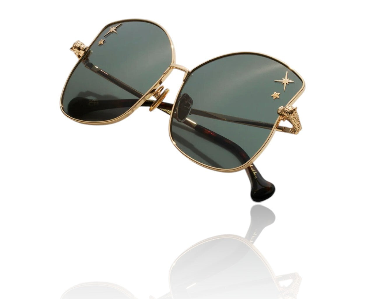 Gold-framed sunglasses with dark lenses on a white background