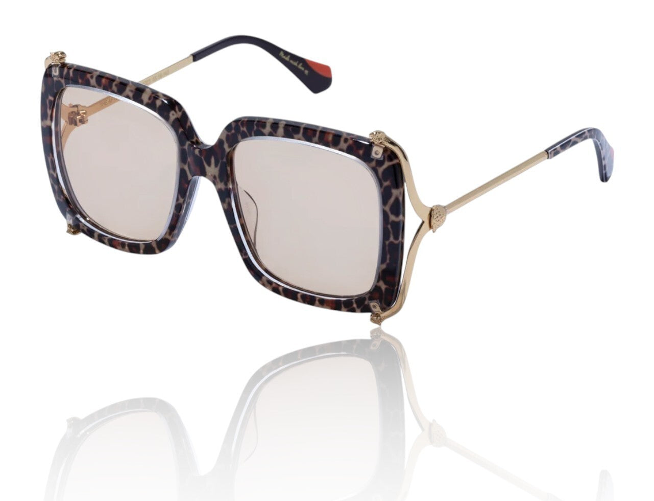 Sunglasses with leopard print frame and reflective lenses on a white background
