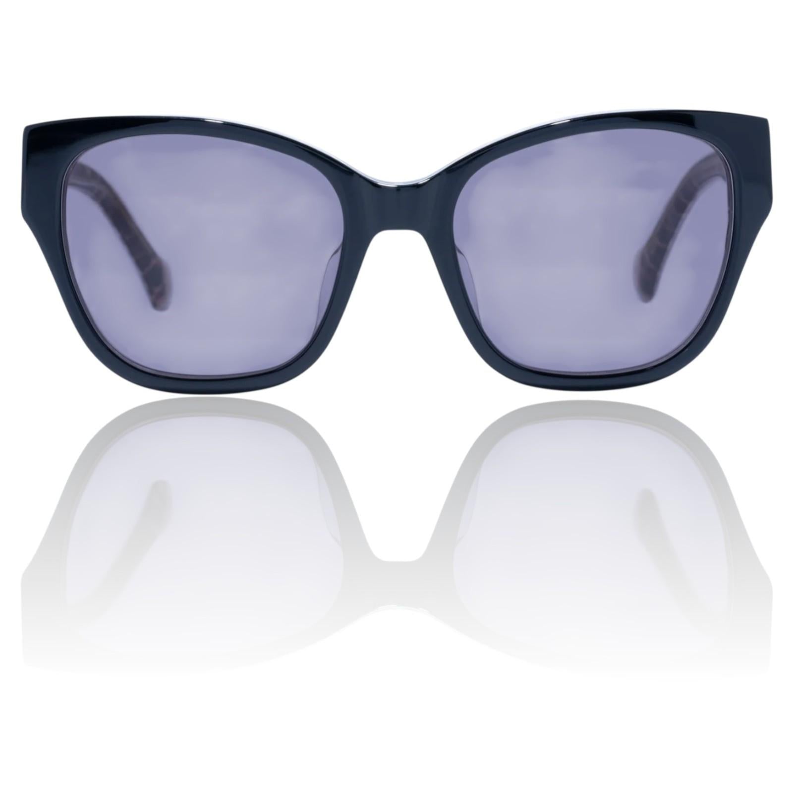 Black cat-eye sunglasses with purple lenses on a white background