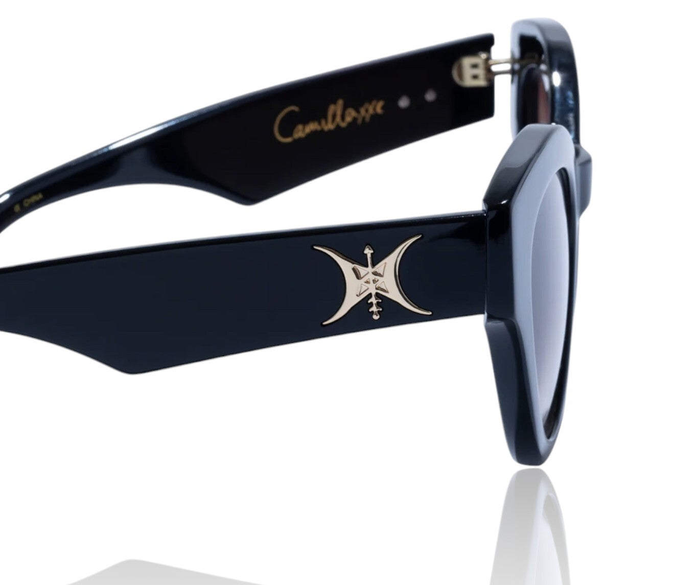 Black sunglasses with gold logo on a white background