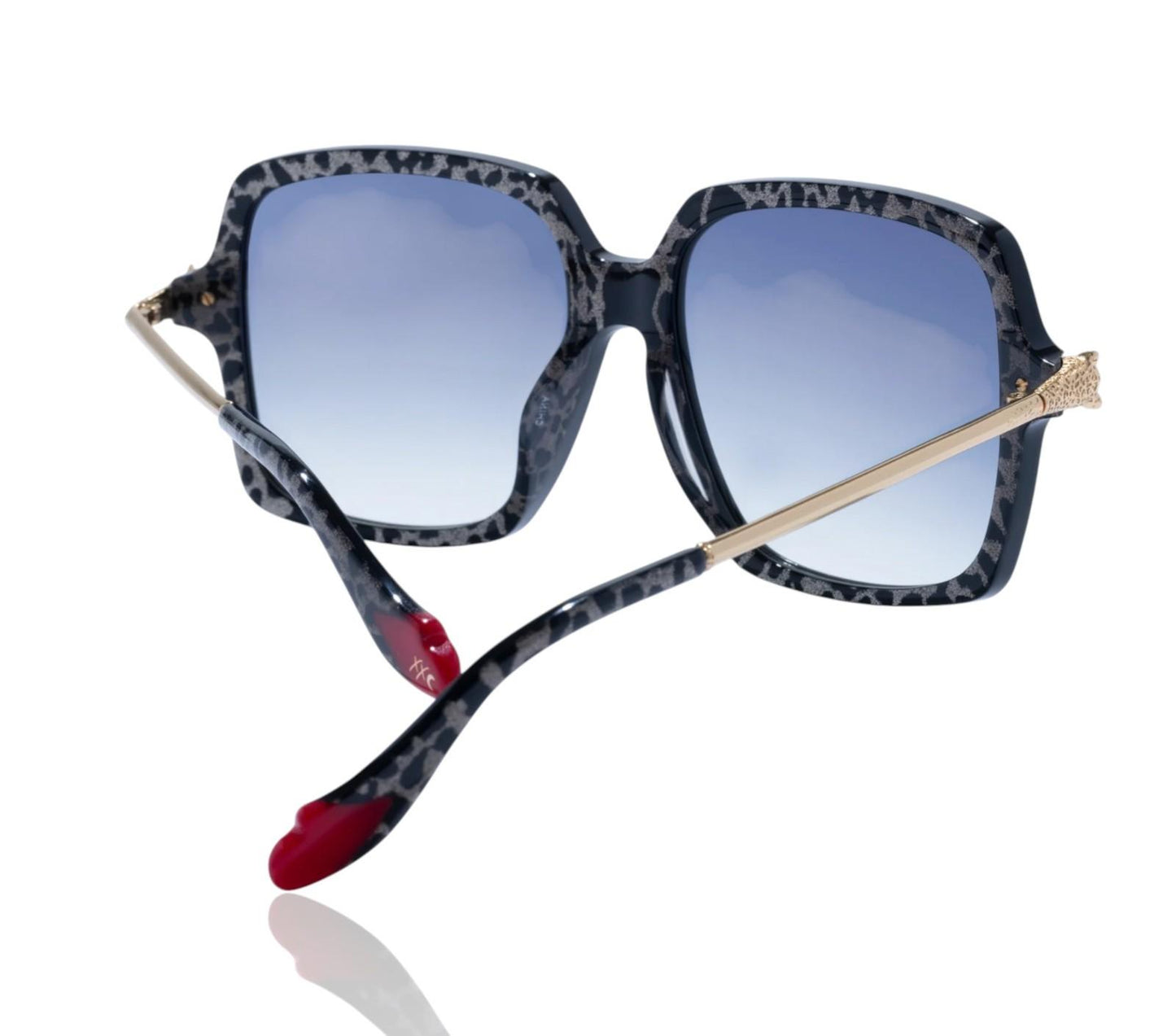 Sunglasses with blue gradient lenses and a unique frame design on a white background