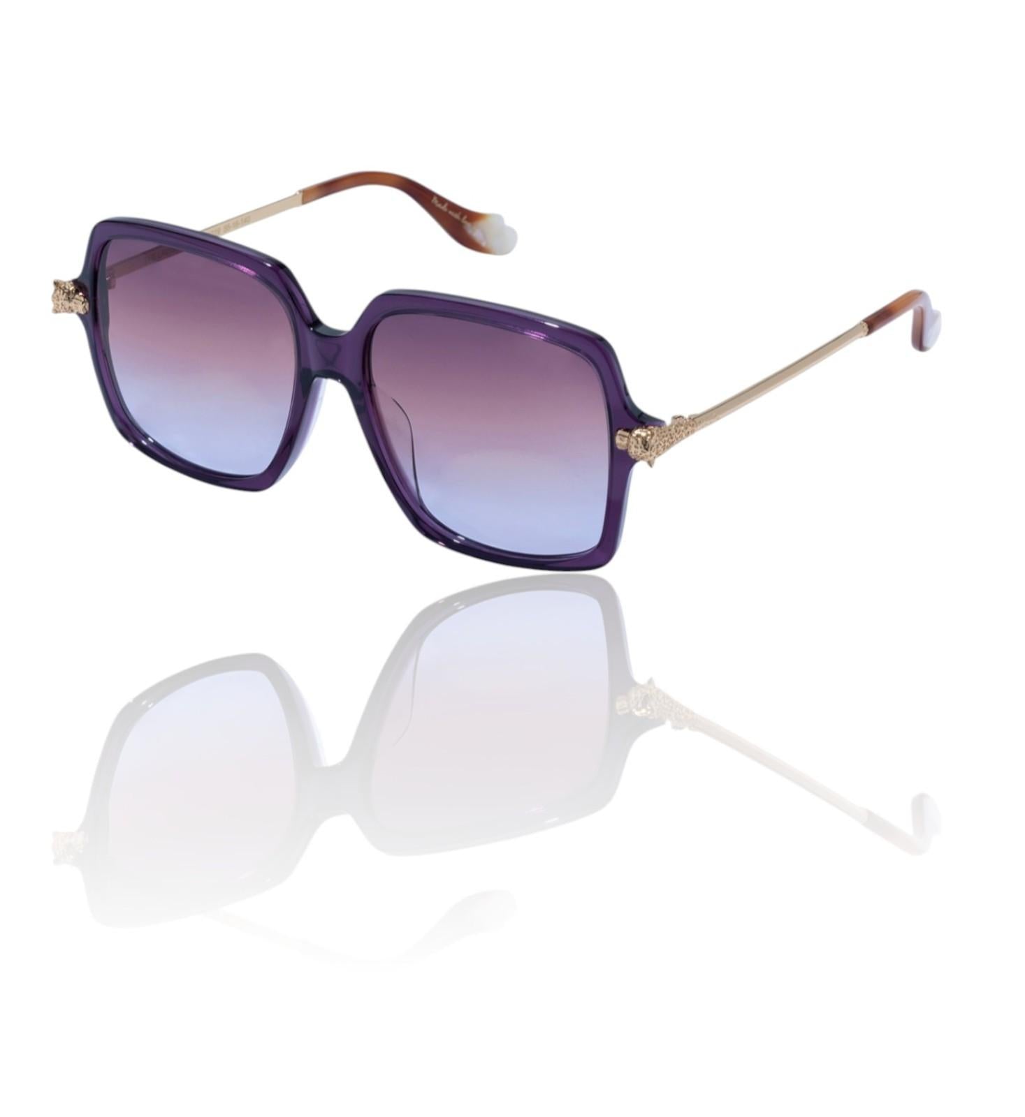 Sunglasses with purple gradient lenses and gold frames on a white background