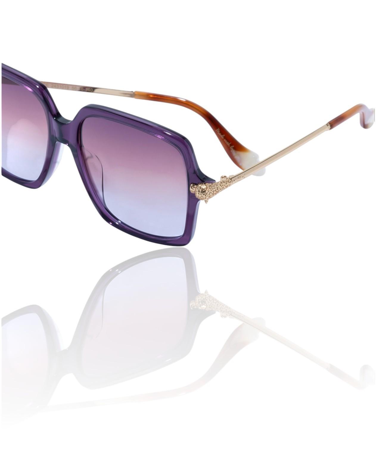 Sunglasses with purple gradient lenses and tortoiseshell frame on a white background