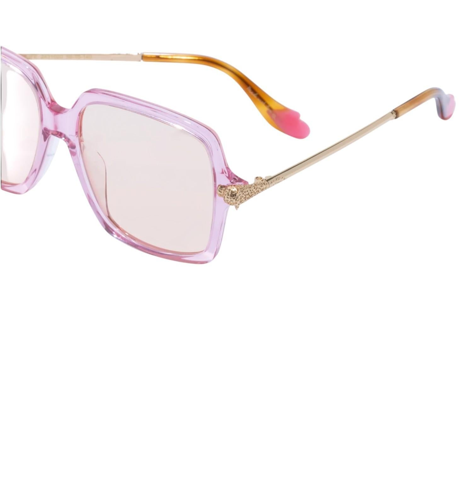 Sunglasses with pink frame and gold accents on a white background