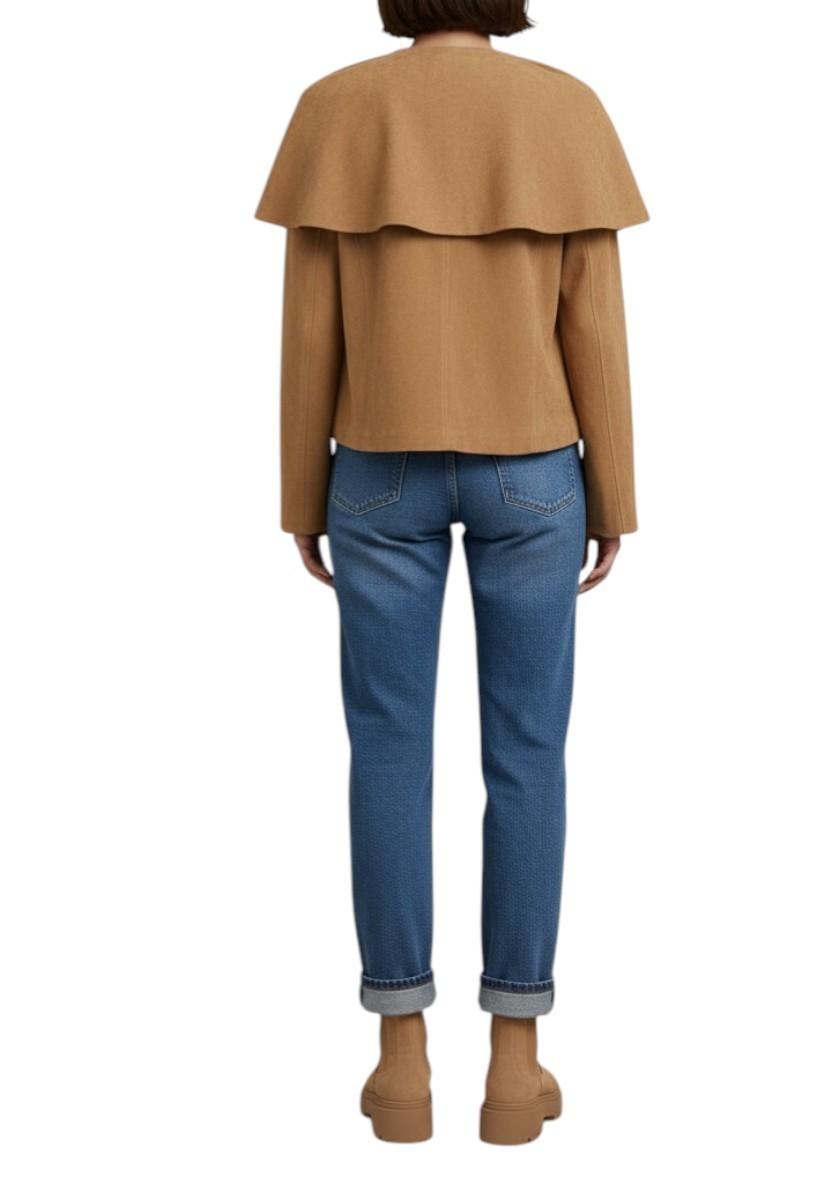 AI generated image of woman wearing a suede camel cape jacket 