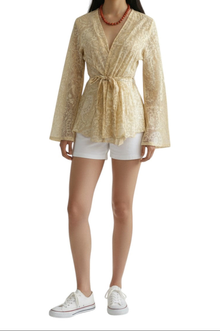AI generated image of Woman wearing a gold patterned top and white shorts on a white background