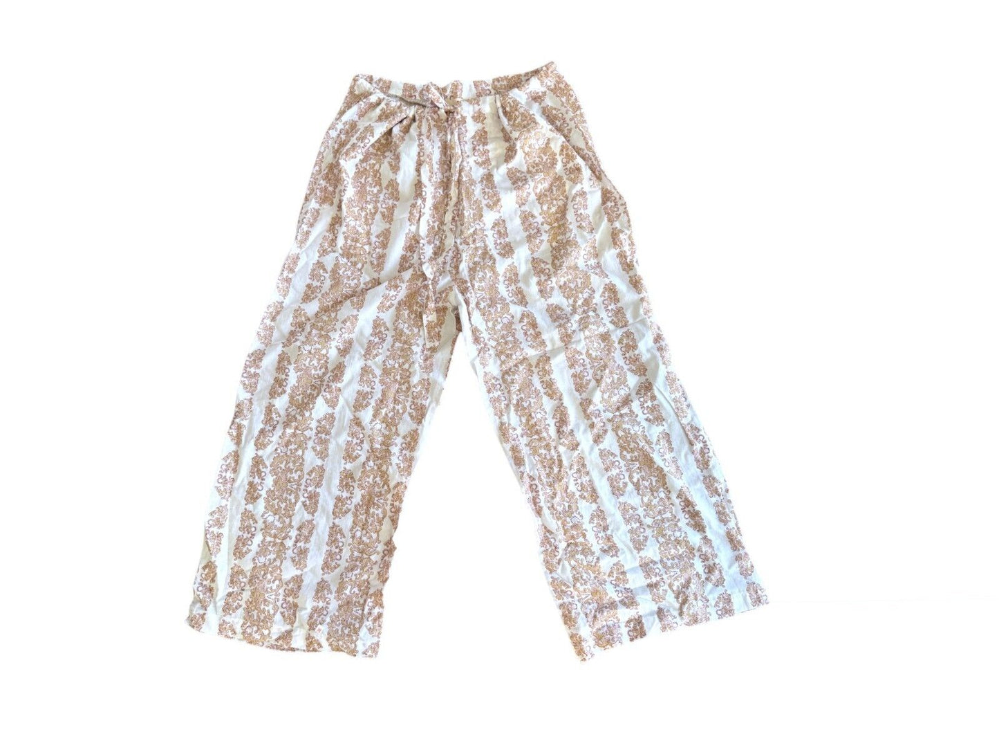 White paisley print cotton pants with a drawstring waist, wide leg fit, and hand-made in India label.