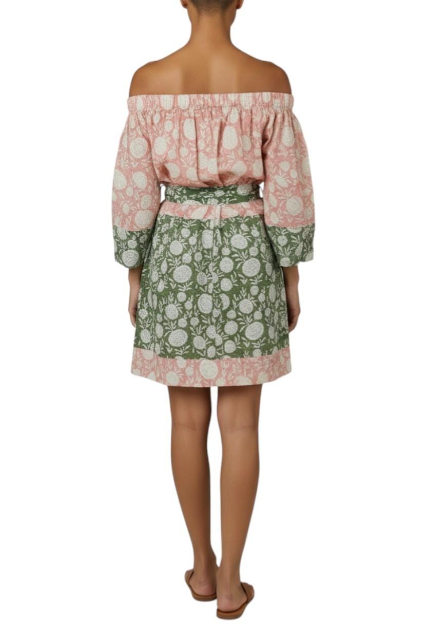 AI generated image of Woman wearing a floral off-shoulder top and skirt on a white background