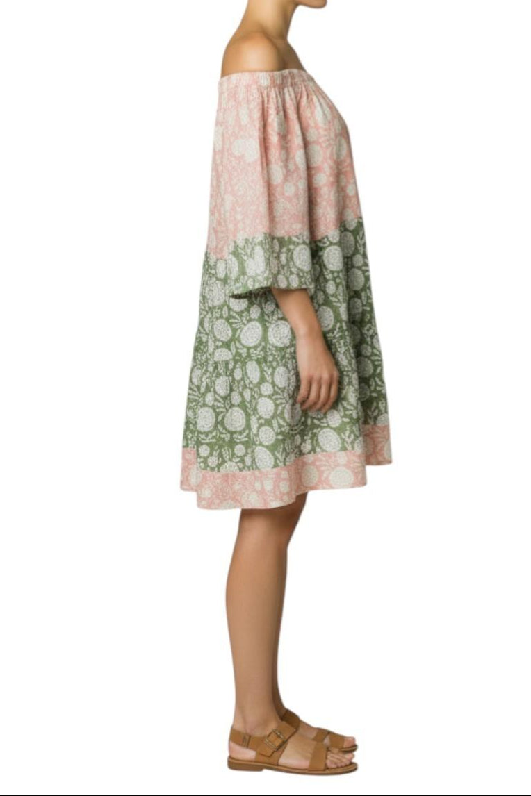 AI generated image of Woman wearing a pink and green off-shoulder dress on a white background